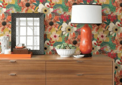 Floral Riot wallpaper by Ohpopsi showcasing bold graphic florals and layered decorative textures.